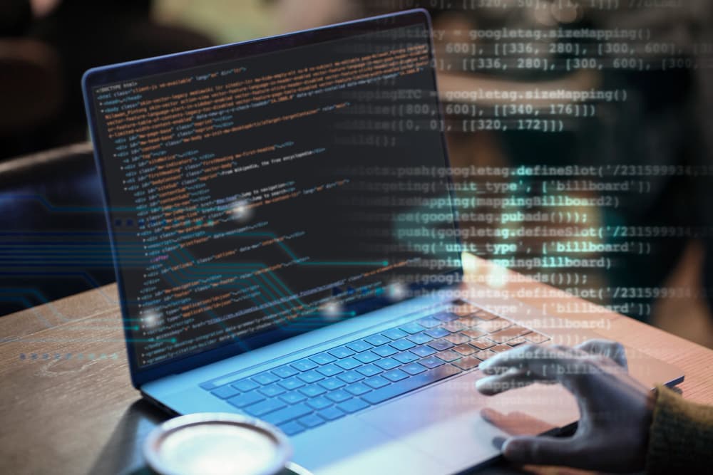Software code layered over a laptop used for systems integration