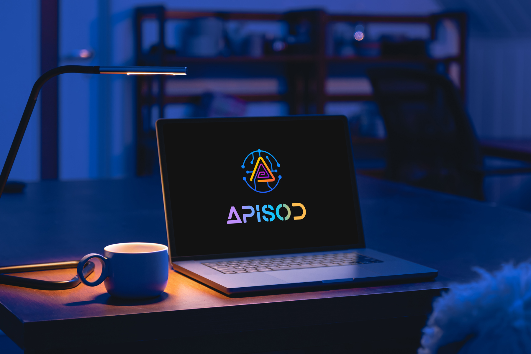 APISOD.ai website displayed on a laptop in a blue-lit workspace